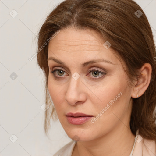 Neutral white adult female with long  brown hair and grey eyes