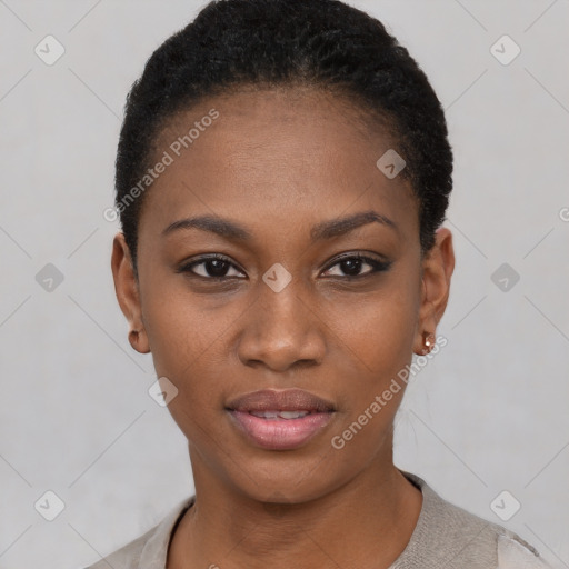 Joyful black young-adult female with short  black hair and brown eyes