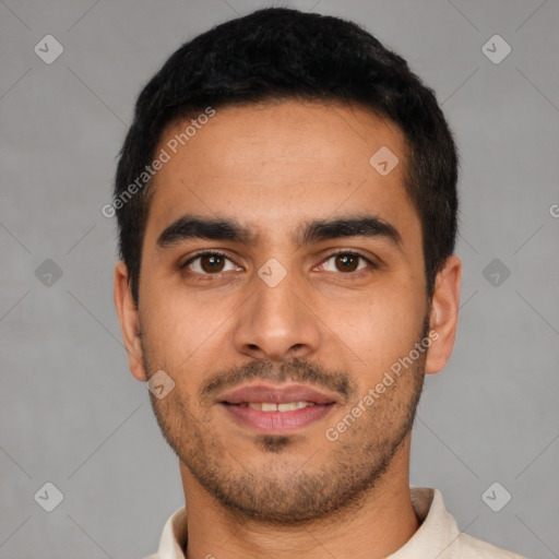 Joyful latino young-adult male with short  black hair and brown eyes