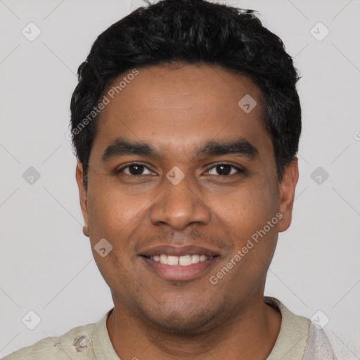 Joyful latino young-adult male with short  black hair and brown eyes