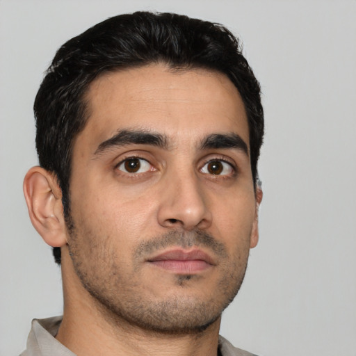 Neutral white young-adult male with short  black hair and brown eyes