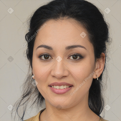 Joyful latino young-adult female with medium  brown hair and brown eyes