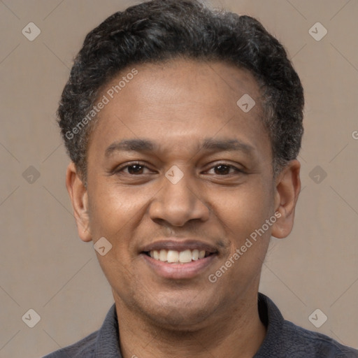 Joyful latino adult male with short  black hair and brown eyes