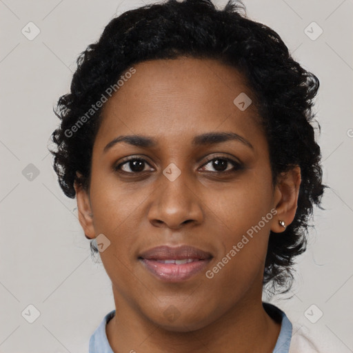 Joyful black young-adult female with short  black hair and brown eyes