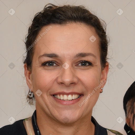 Joyful white adult female with short  brown hair and brown eyes