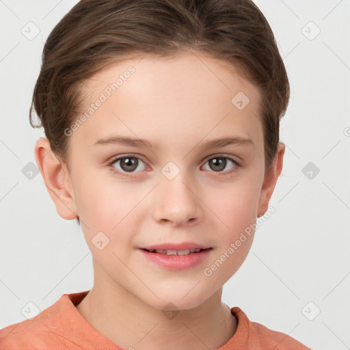 Joyful white child female with short  brown hair and grey eyes