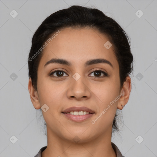 Joyful latino young-adult female with short  brown hair and brown eyes