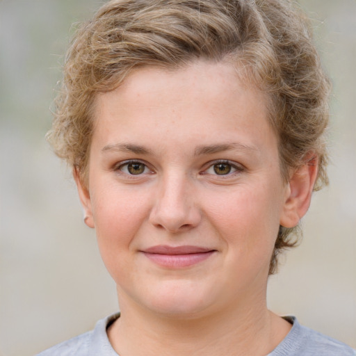 Joyful white child female with medium  brown hair and grey eyes