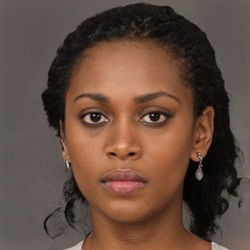 Neutral black young-adult female with long  black hair and brown eyes