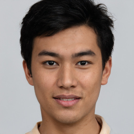 Joyful latino young-adult male with short  brown hair and brown eyes