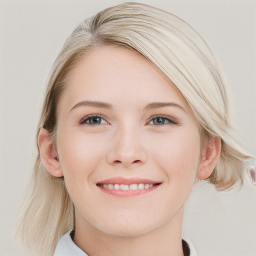 Joyful white young-adult female with long  brown hair and blue eyes