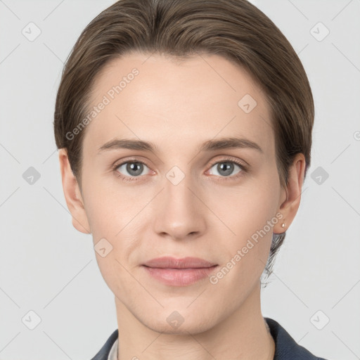 Joyful white young-adult female with short  brown hair and grey eyes