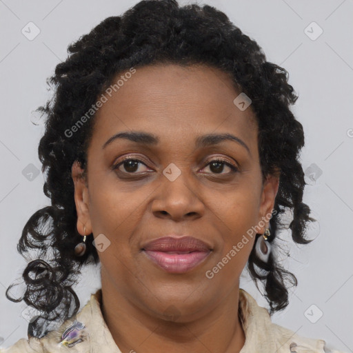 Joyful black adult female with medium  brown hair and brown eyes