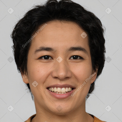 Joyful latino young-adult male with short  brown hair and brown eyes