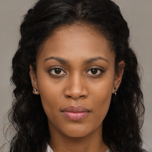 Neutral black young-adult female with long  brown hair and brown eyes