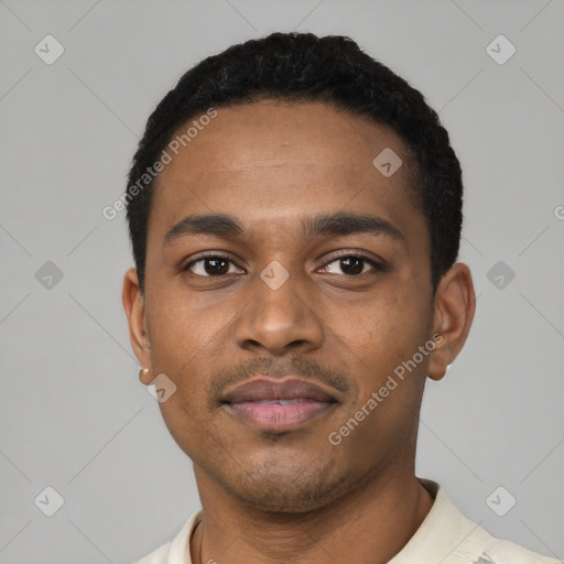 Joyful black young-adult male with short  black hair and brown eyes