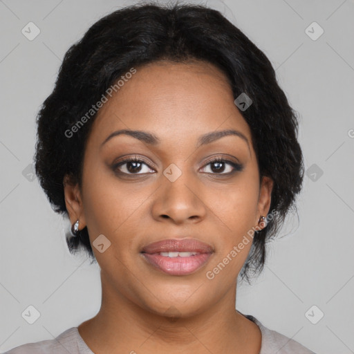 Joyful black young-adult female with short  black hair and brown eyes