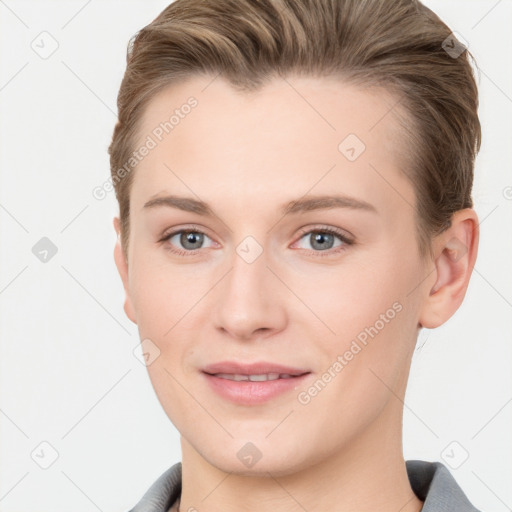 Joyful white young-adult female with short  brown hair and grey eyes