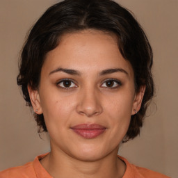 Joyful white young-adult female with medium  brown hair and brown eyes