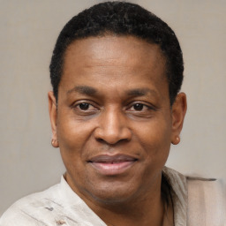 Joyful black adult male with short  black hair and brown eyes