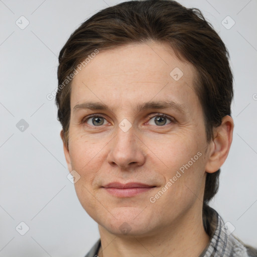 Joyful white adult female with short  brown hair and grey eyes