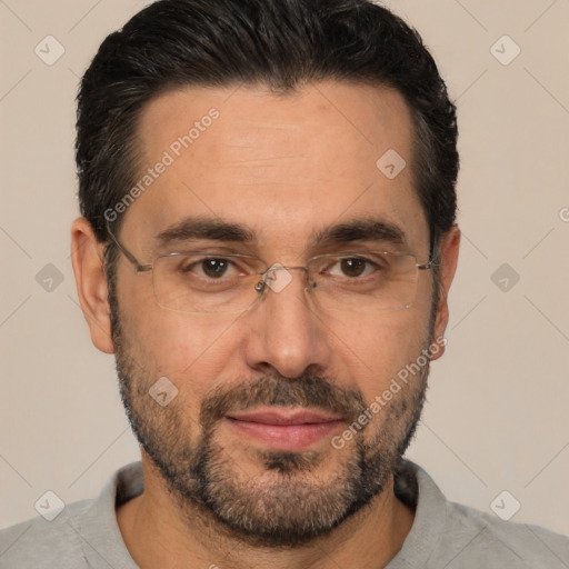 Joyful white adult male with short  black hair and brown eyes