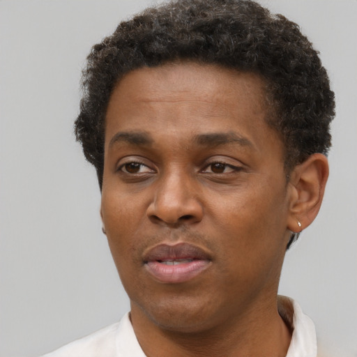 Neutral black young-adult male with short  brown hair and brown eyes