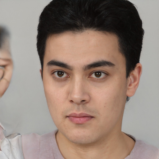 Neutral latino young-adult male with short  brown hair and brown eyes