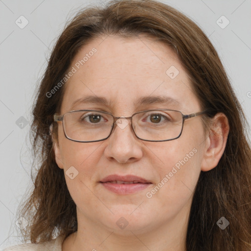 Joyful white adult female with long  brown hair and grey eyes