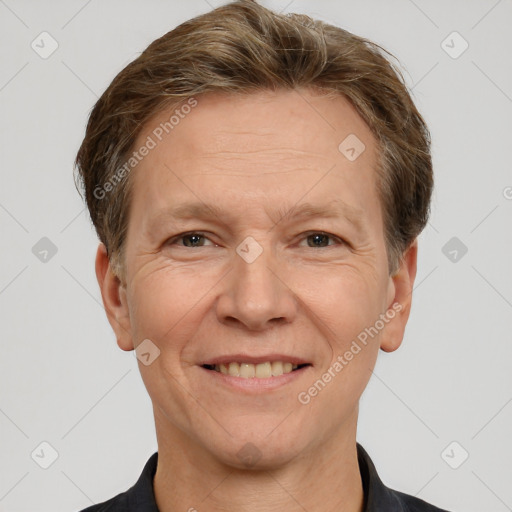 Joyful white adult male with short  brown hair and grey eyes