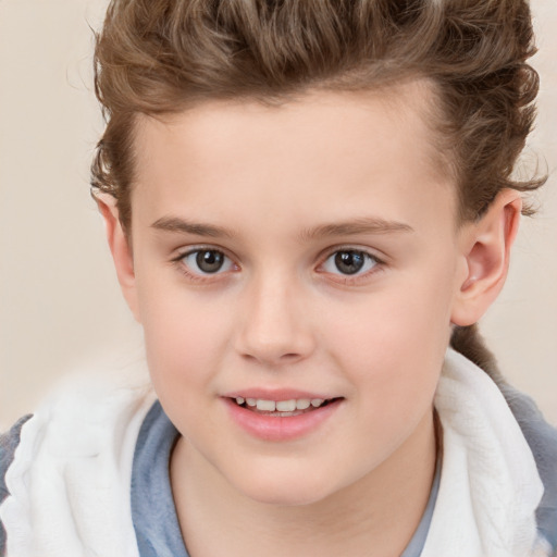 Joyful white child female with short  brown hair and brown eyes