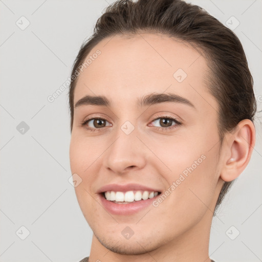 Joyful white young-adult female with short  brown hair and brown eyes