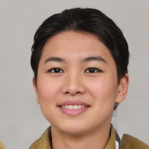 Joyful asian young-adult female with medium  brown hair and brown eyes