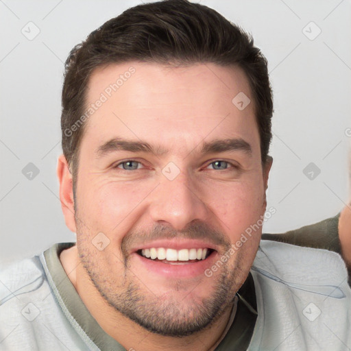 Joyful white young-adult male with short  brown hair and brown eyes