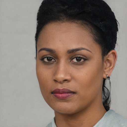 Neutral black young-adult female with short  black hair and brown eyes
