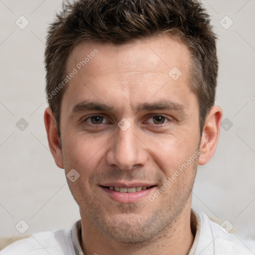 Joyful white adult male with short  brown hair and brown eyes