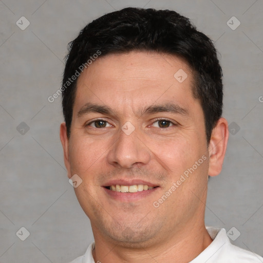 Joyful white adult male with short  brown hair and brown eyes