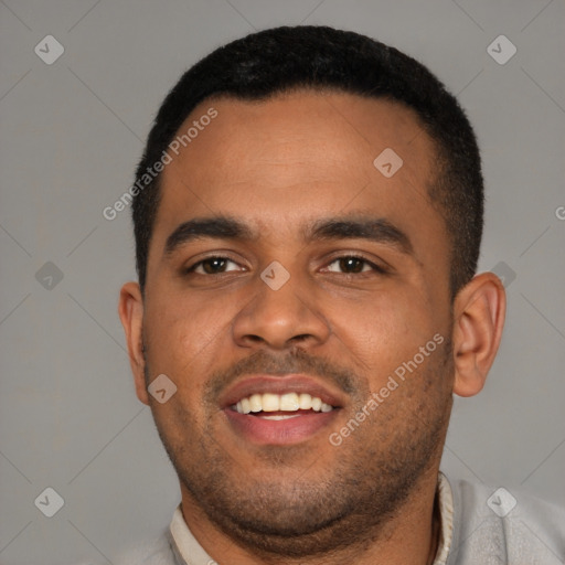 Joyful black young-adult male with short  black hair and brown eyes