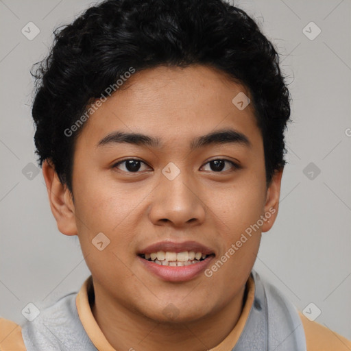 Joyful latino young-adult male with short  black hair and brown eyes