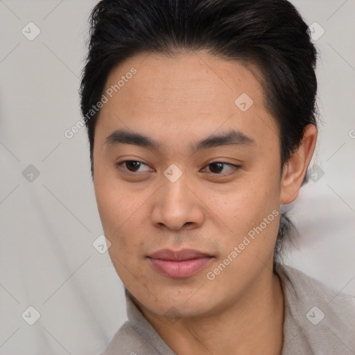 Joyful asian young-adult male with short  brown hair and brown eyes
