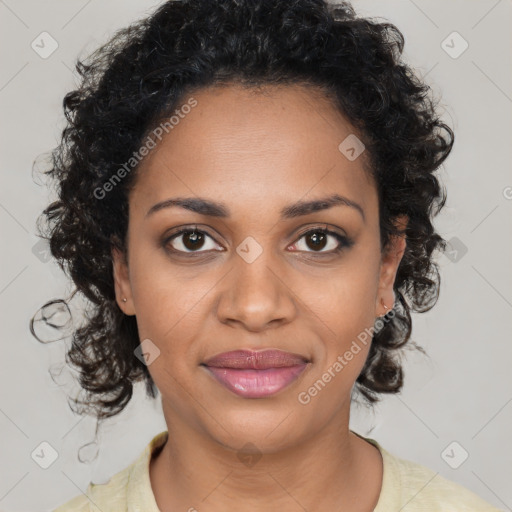 Joyful black young-adult female with medium  brown hair and brown eyes