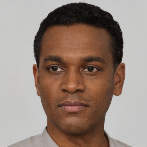 Neutral black young-adult male with short  black hair and brown eyes