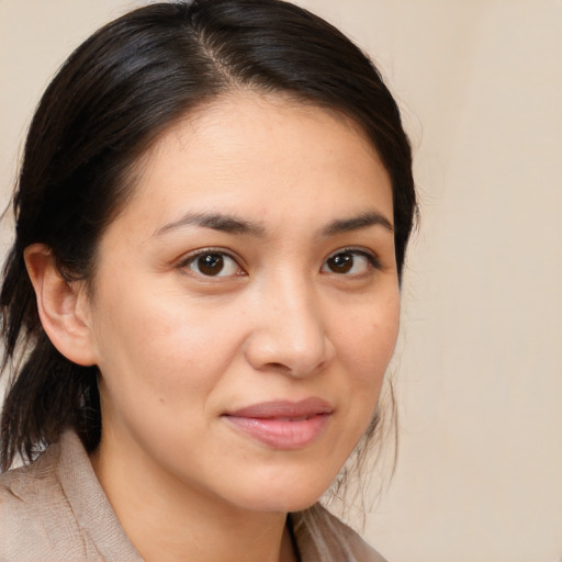 Joyful white young-adult female with medium  brown hair and brown eyes