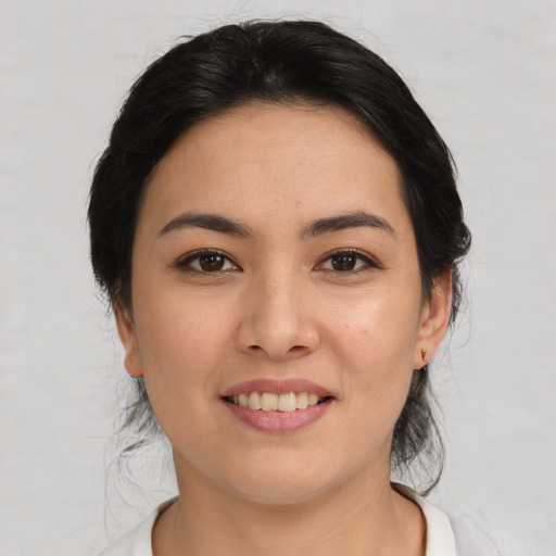 Joyful asian young-adult female with medium  black hair and brown eyes