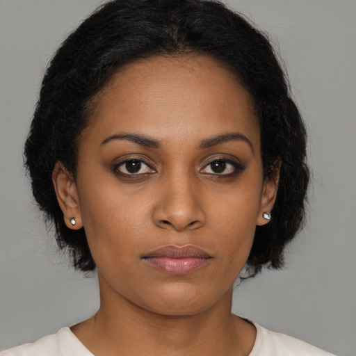 Neutral black young-adult female with long  black hair and brown eyes