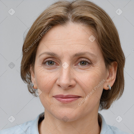 Joyful white adult female with medium  brown hair and brown eyes