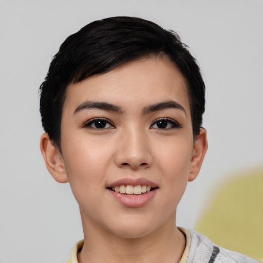 Joyful asian young-adult female with short  black hair and brown eyes