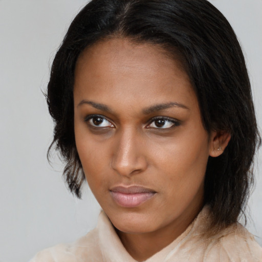 Neutral black young-adult female with medium  brown hair and brown eyes