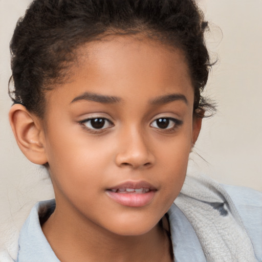 Joyful white child female with short  brown hair and brown eyes