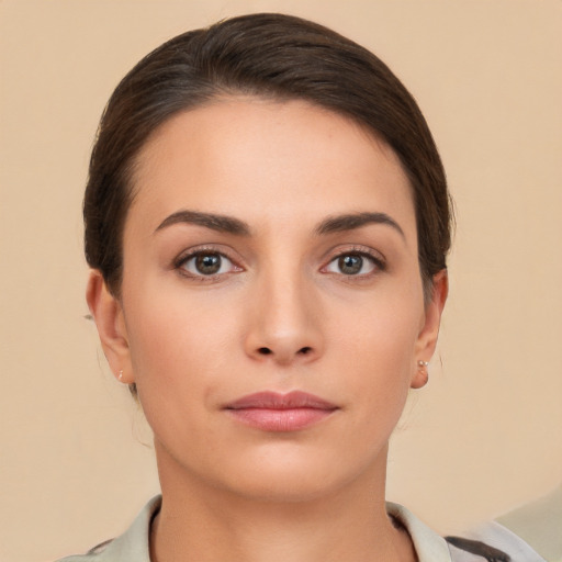 Neutral white young-adult female with short  brown hair and brown eyes